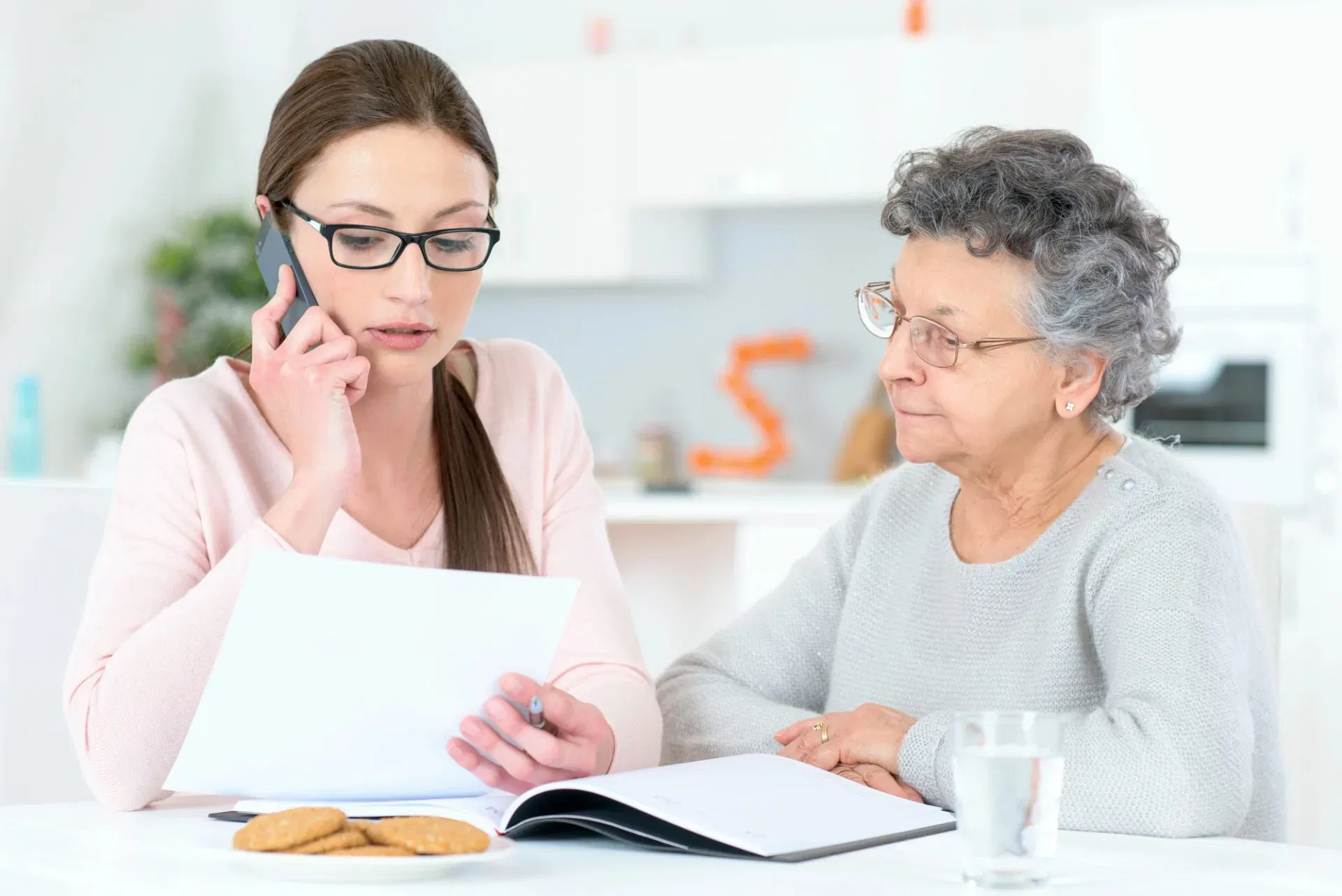 Beneficiary reviewing trust accounting documents with an estate litigation lawyer during a legal consultation.