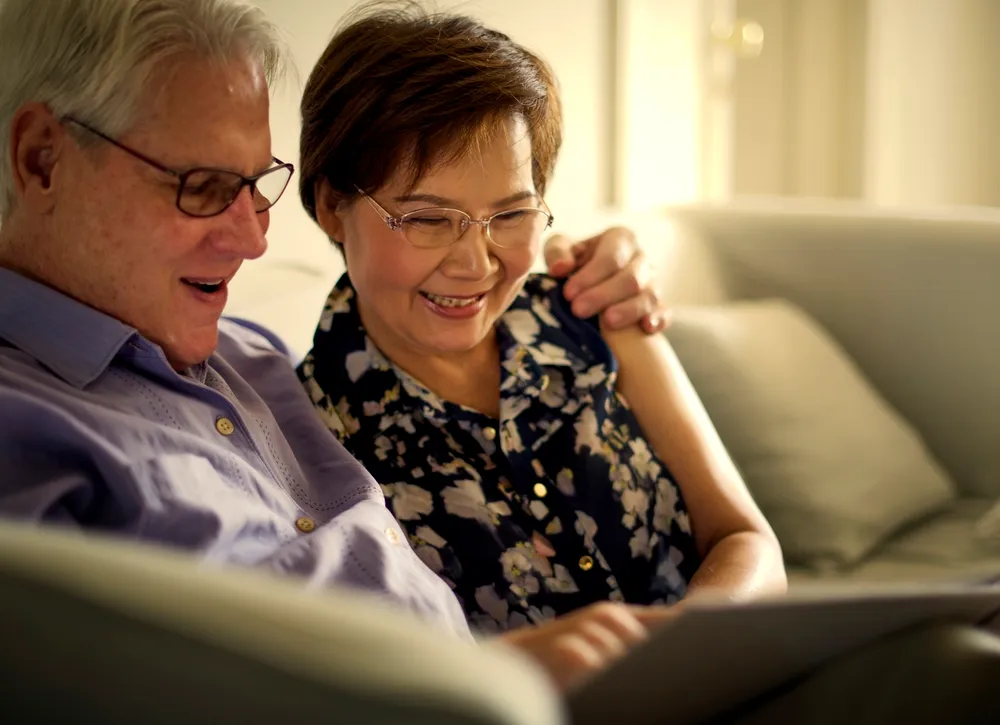 photo of a foreign elderly couple relaxing at home