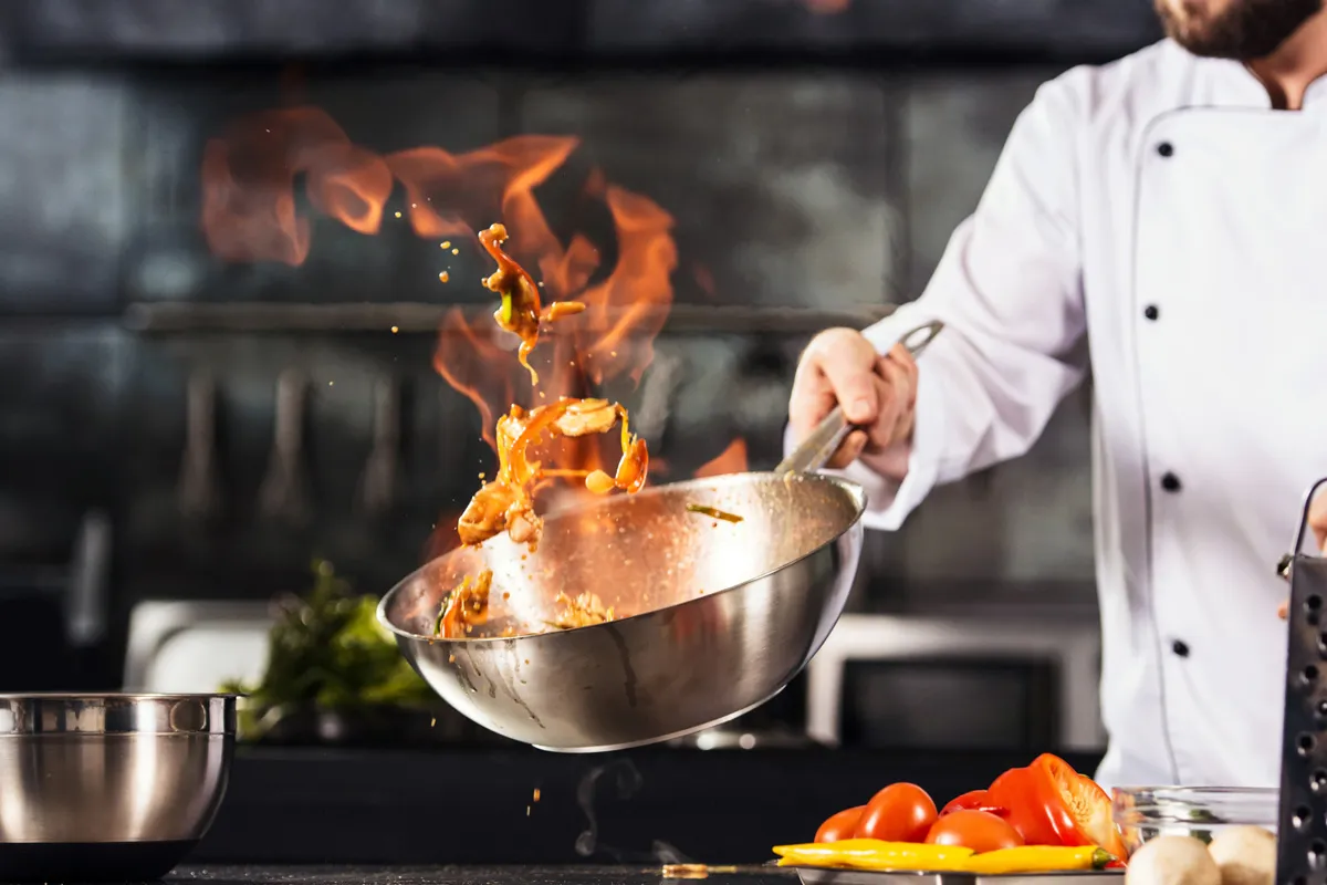 photo of a cook at an asian food restaurant