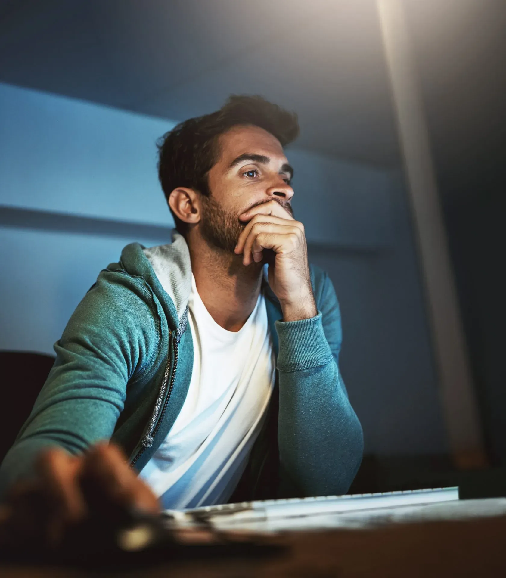 photo of a young man researching the internet